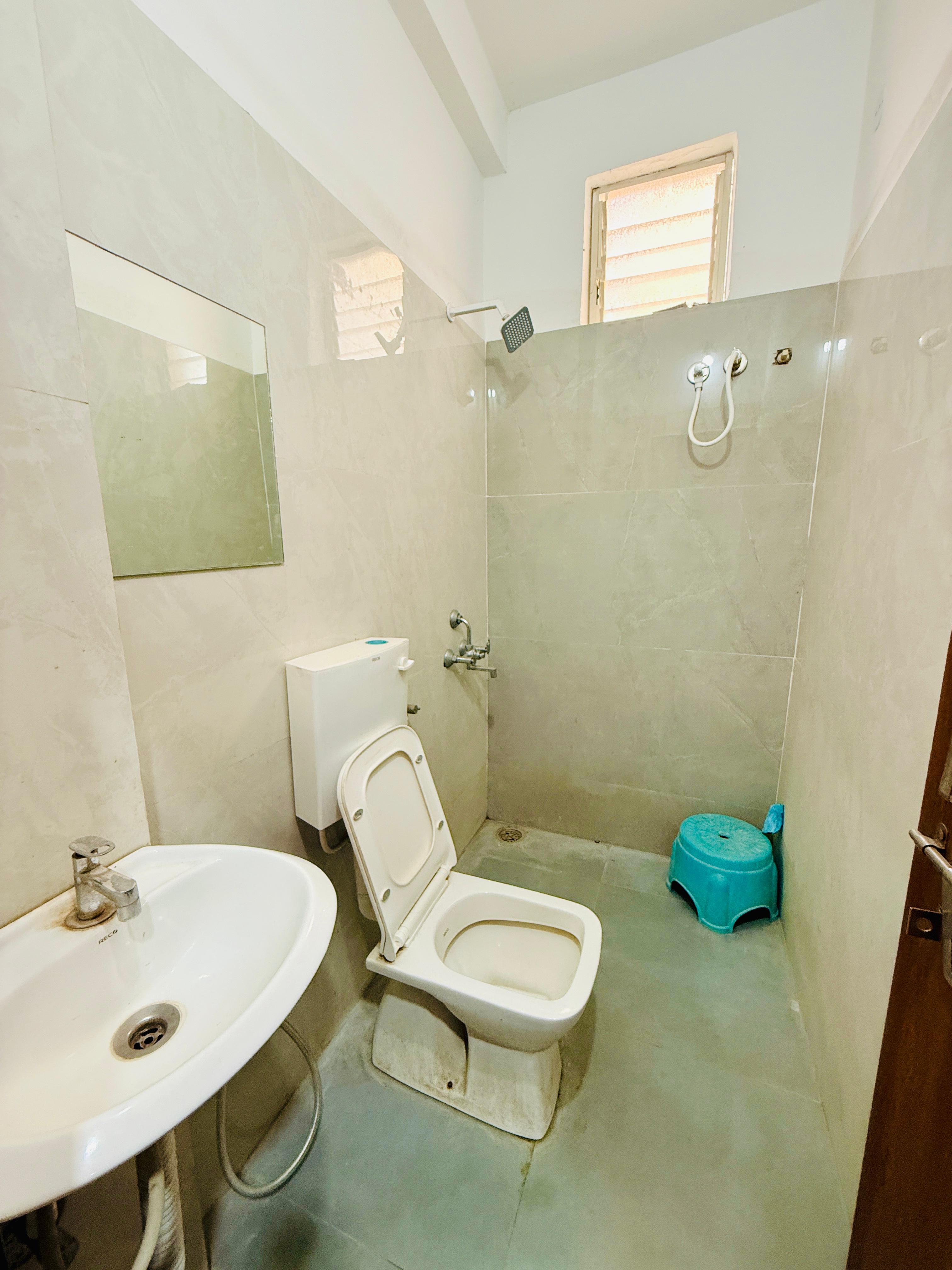 Clean private bathroom at Radiance Residency hostel